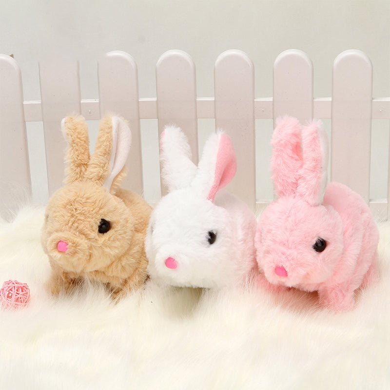 Three fluffy rabbit plush toys in beige, white, and pink, interactive educational toy for kids that can walk and talk