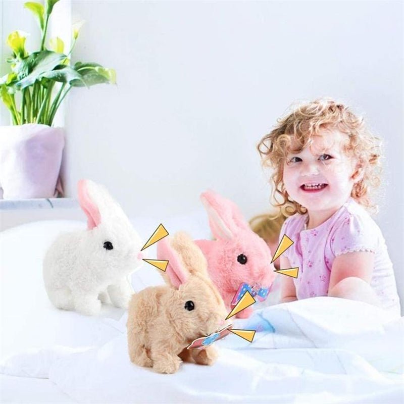 A smiling child playing with three colorful interactive educational toys for kids that walk and talk, in a bright room.