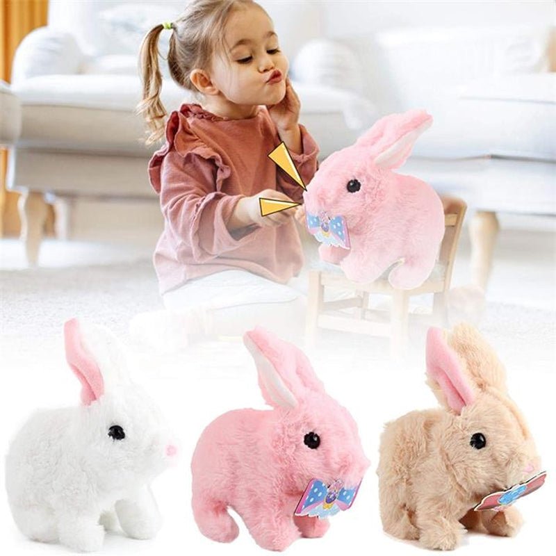 A girl interacting with a pink plush bunny alongside other colorful bunnies, showcasing an interactive educational toy for kids.