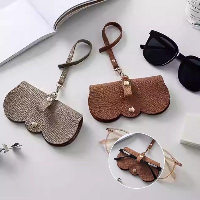 Two stylish fashion sunglasses cases in brown and beige leather, perfect for protecting eyewear on the go