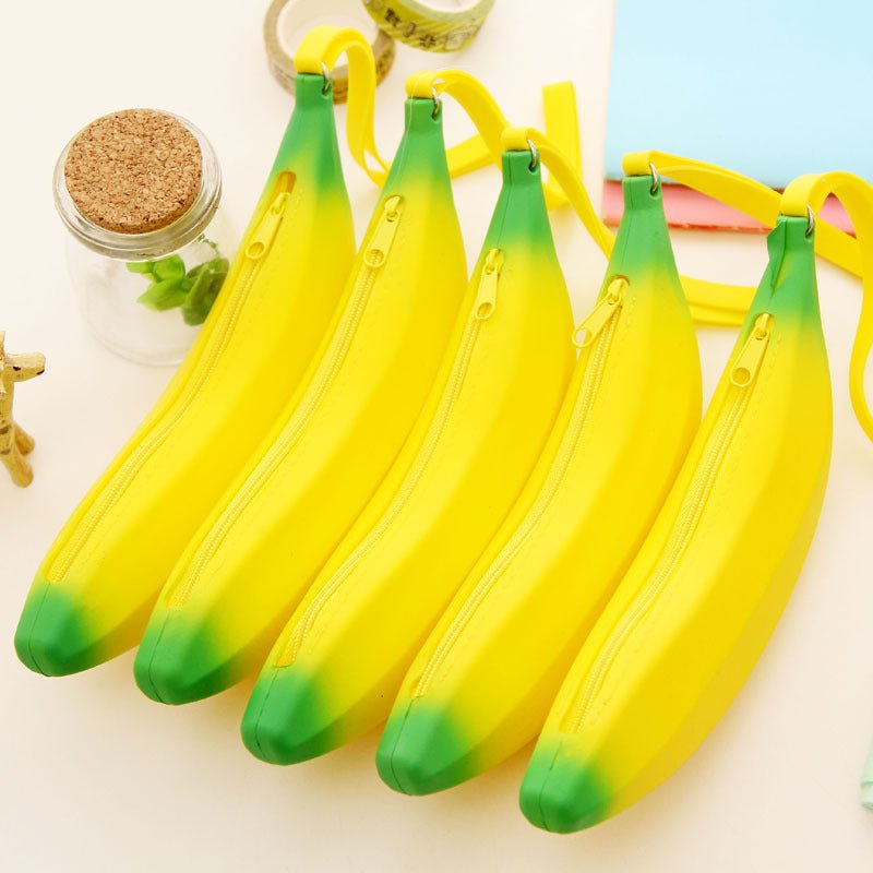 Colorful silicone banana storage bag in vibrant yellow with green accents, ideal for organizing stationery and accessories