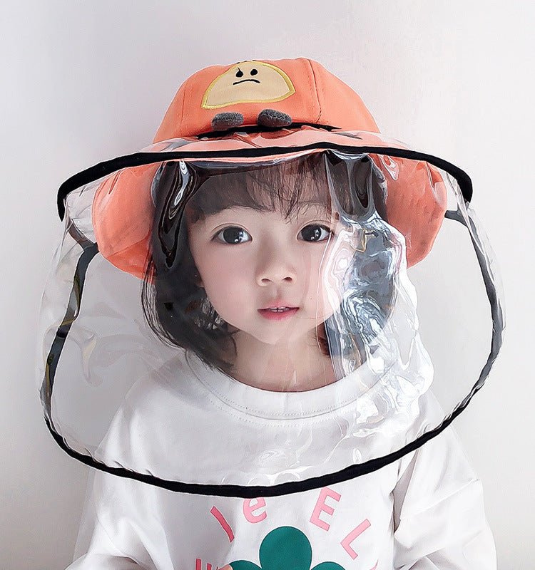 Child wearing an anti-spitting fisherman hat with a clear visor for protection against splashes and droplets