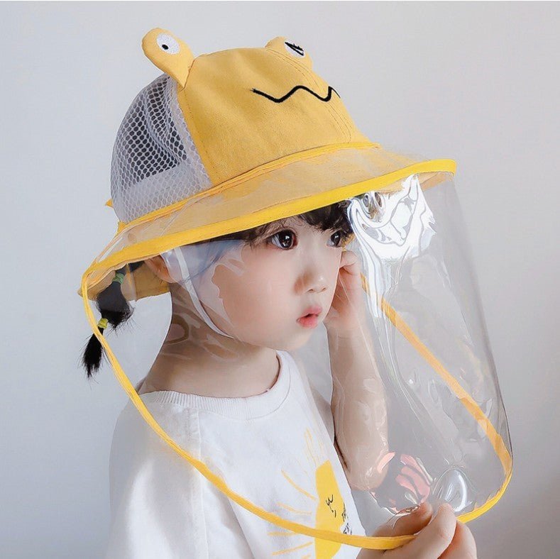 Child wearing an anti-spitting fisherman hat with a clear visor and playful frog design, perfect for outdoor activities