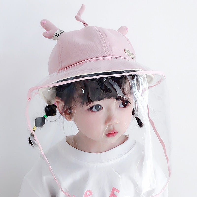 A cute pink anti-spitting fisherman hat with a clear protective visor and playful design for kids, ideal for outdoor use