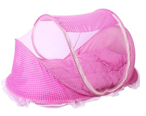 Foldable baby bed net in pink with polka dots and a soft padded interior for comfortable sleep and protection